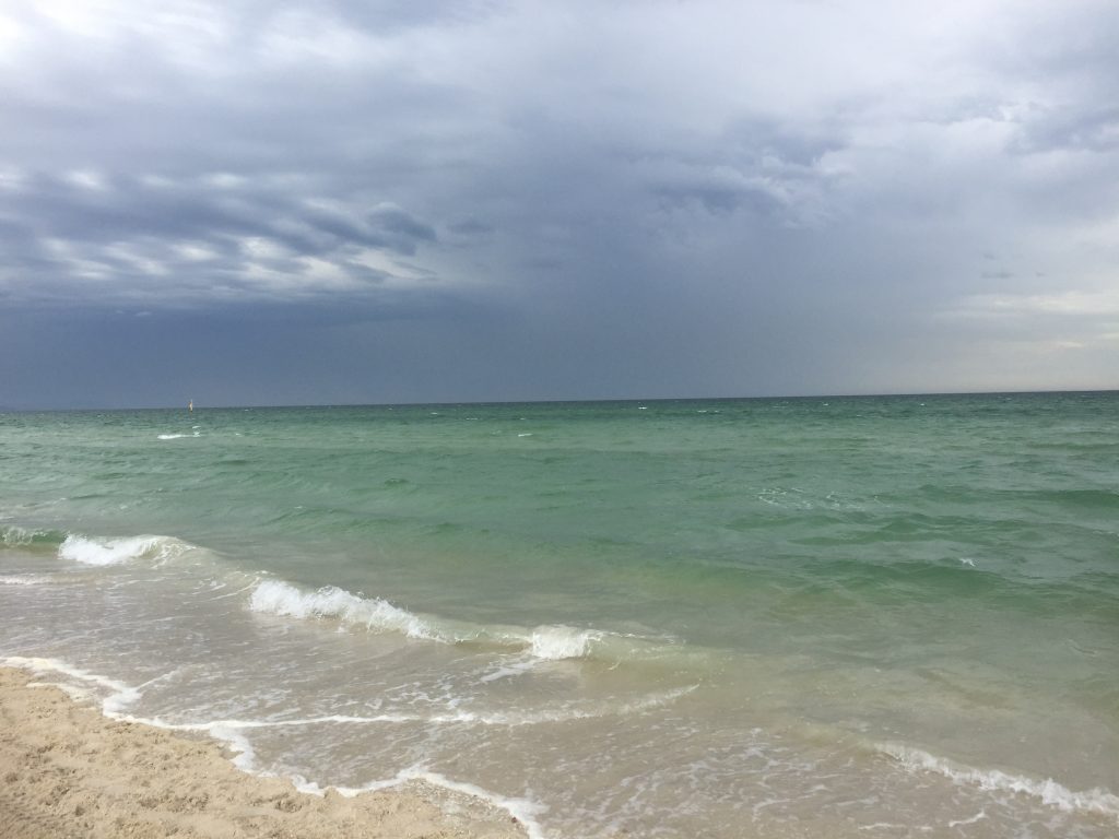 Serene waves and blue sky.