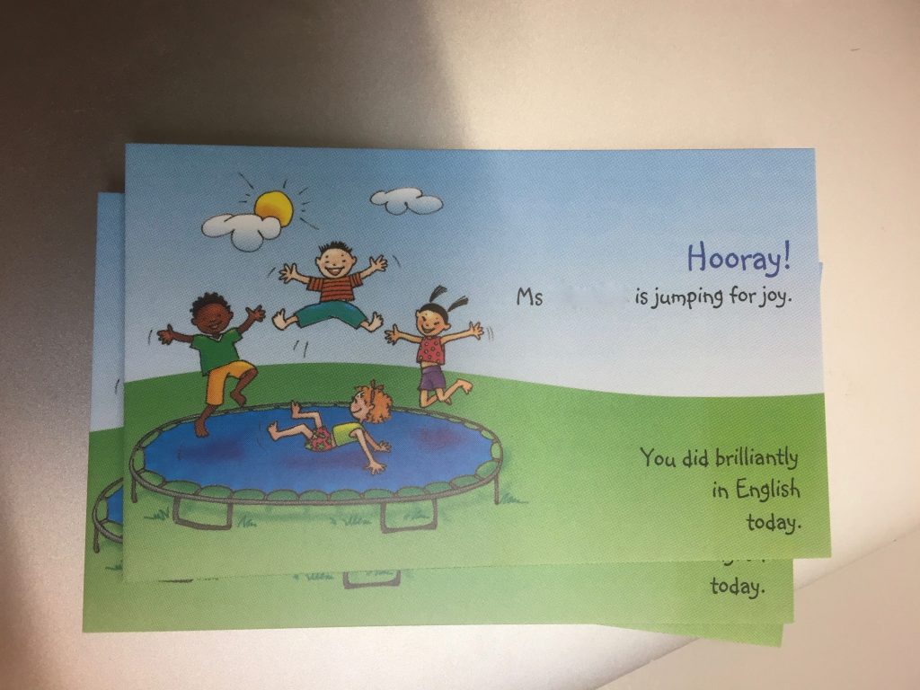 Card with 'Ms Jones is jumping for joy. Today you did brilliantly in English!