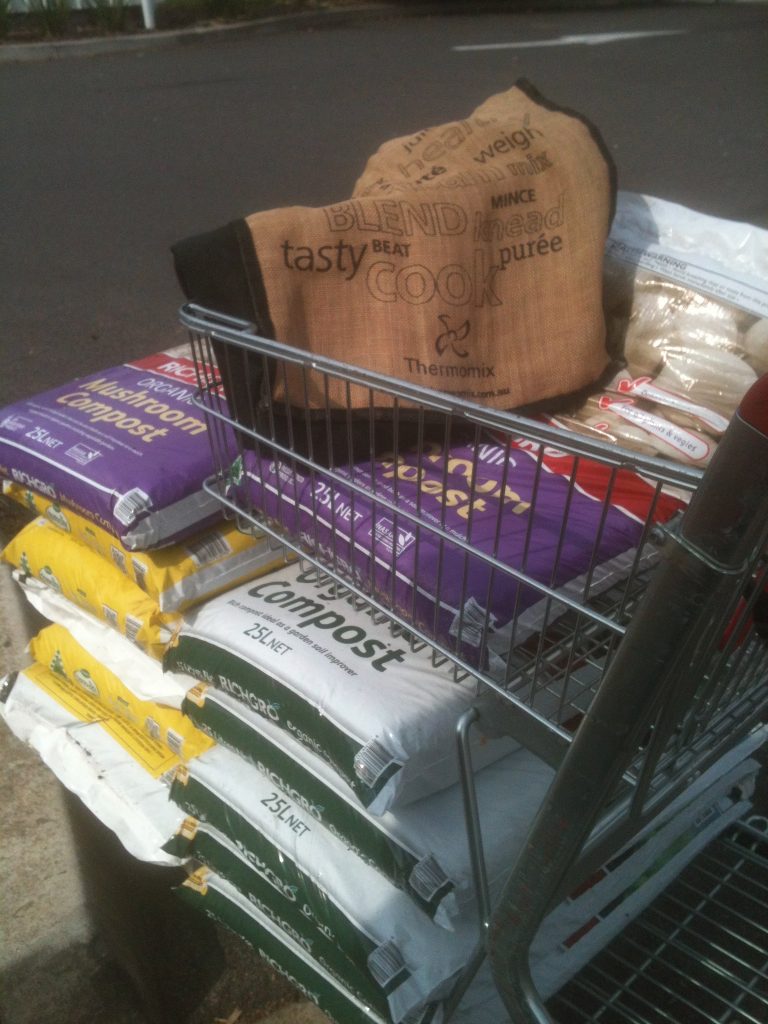 Shopping for compost to build up the soil.