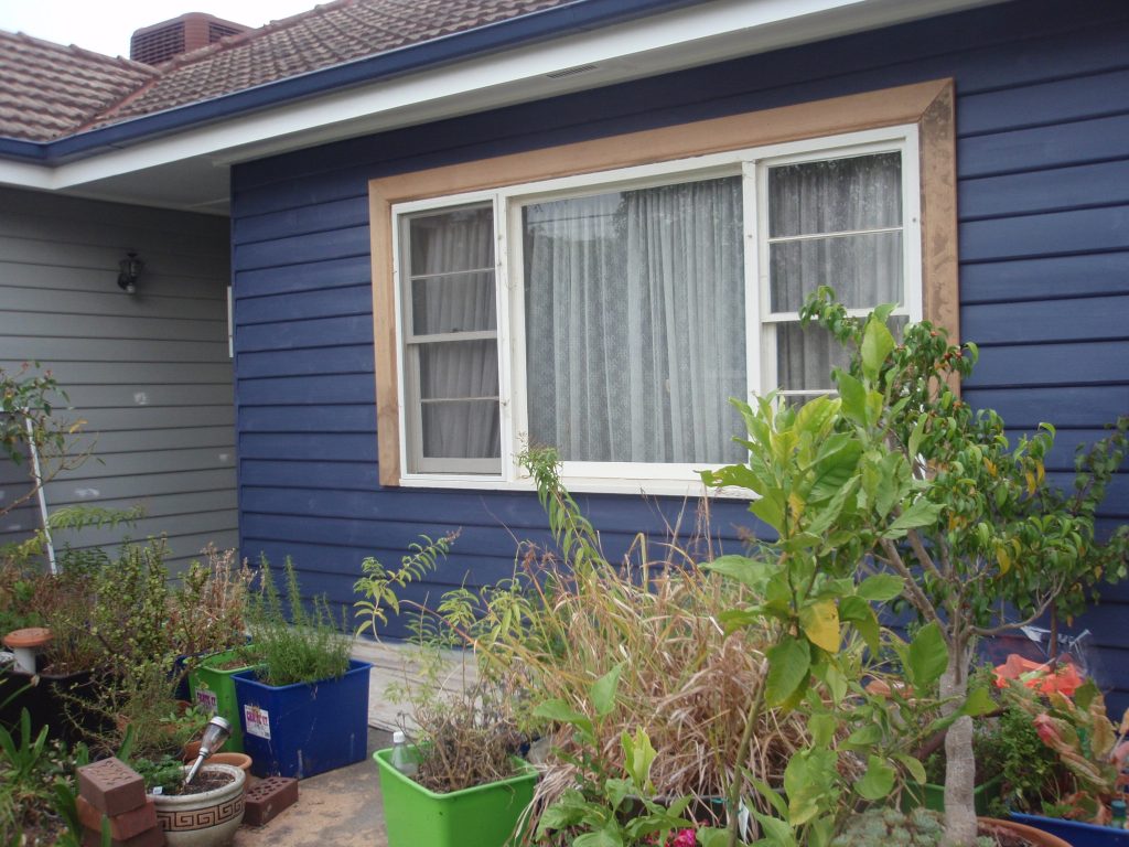 My house in the middle of painting it dark blue.