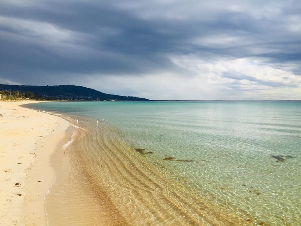 The beach at the end of her street.