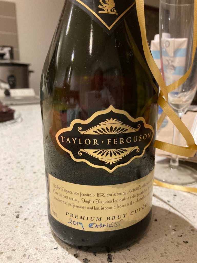 Bottle of champagne with "2019 EARNEST" written on the label. My theatre students' gift.