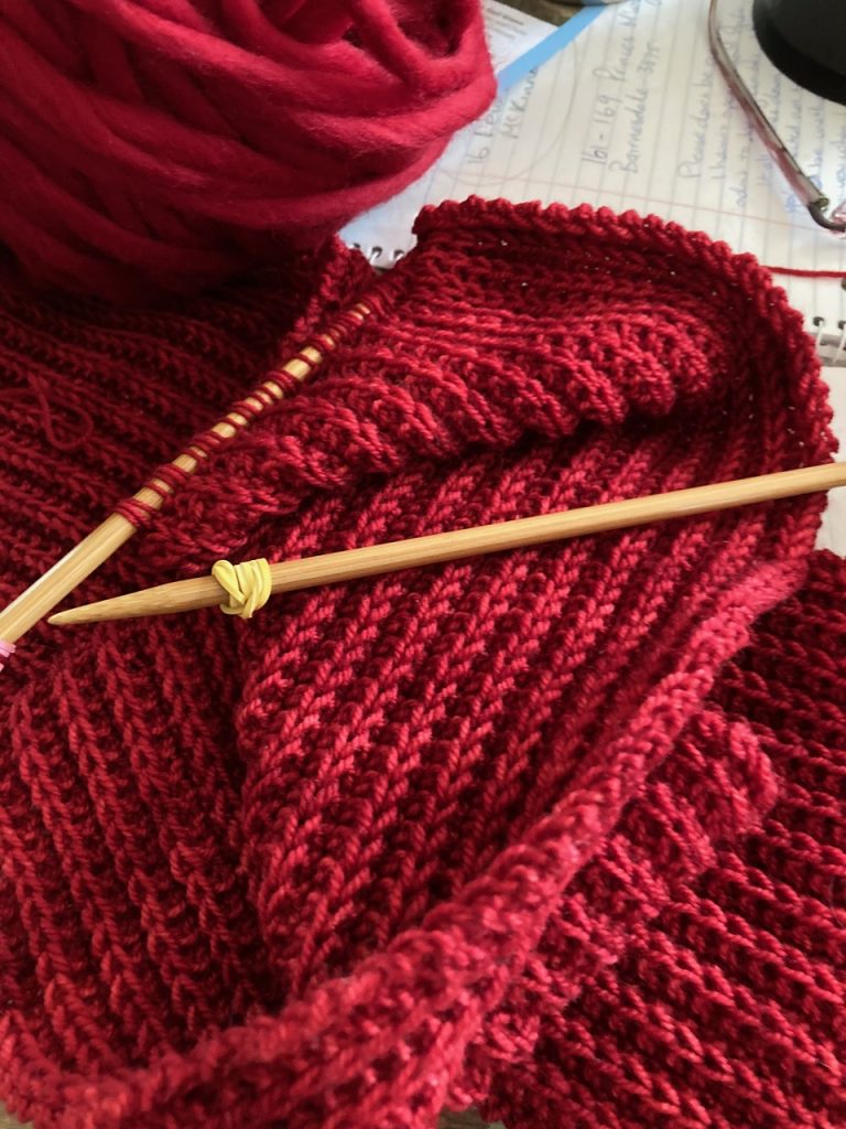 Bright red knitting.