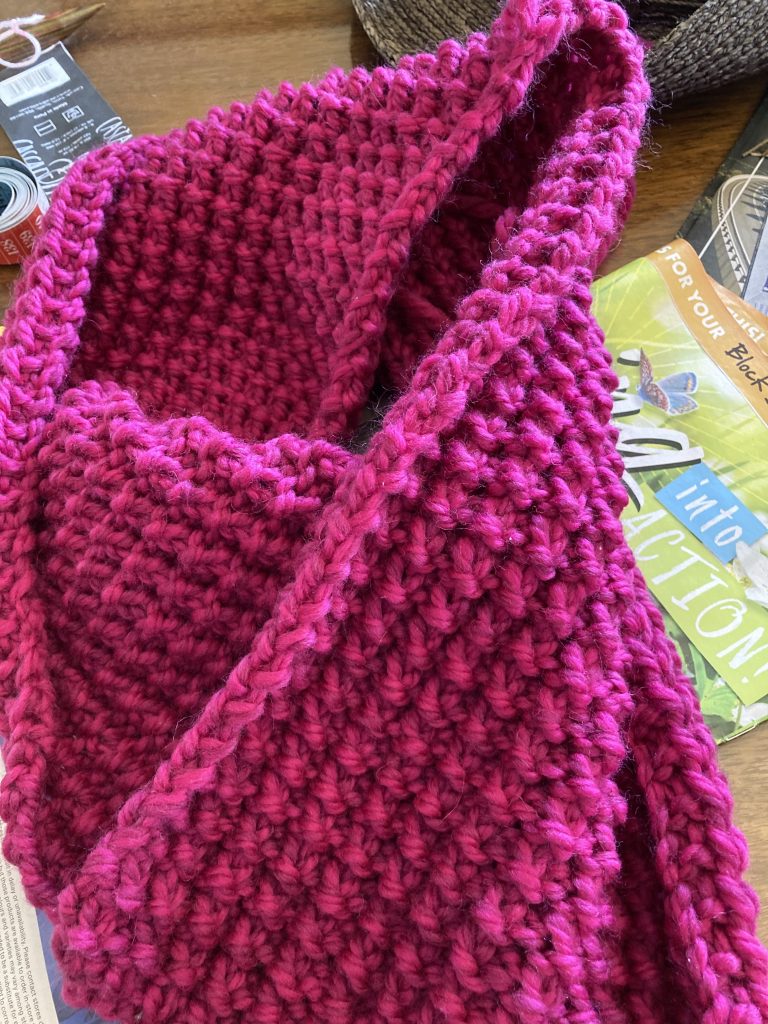 Bright pink rice stitch cowl.