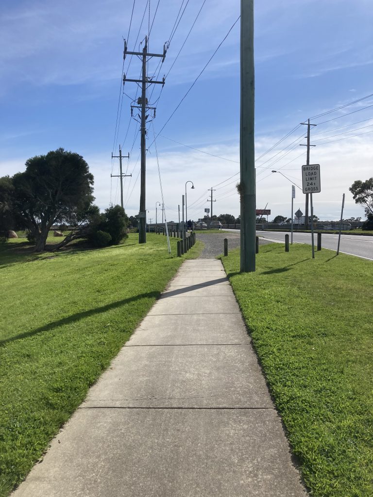 Suburban path over bridge.