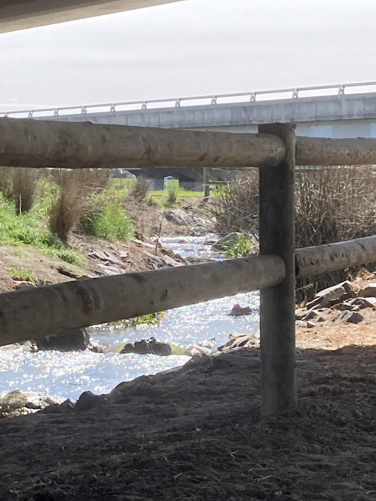 River under bridge.